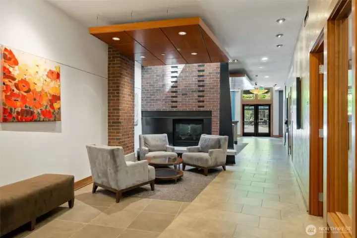Welcoming lobby entrance with a sitting area and a gas fireplace.