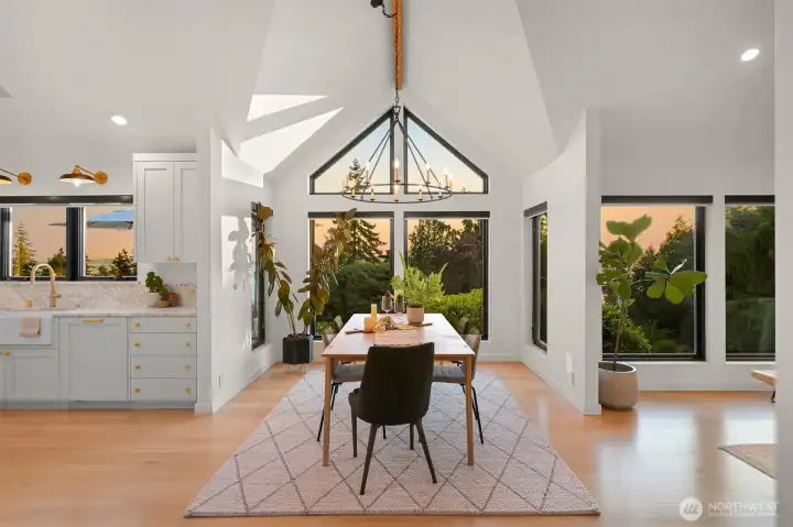 Step inside, and you'll be captivated by the soaring vaulted ceilings with exposed beams, adding a sense of grandeur and warmth to the living spaces.