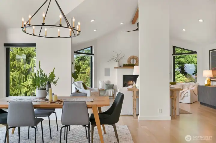 The formal dining room, bathed in natural light, sets the stage for elegant dinner parties or intimate family meals.