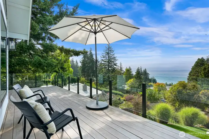 A seamless transition to outdoor living includes an Ipe deck that invites you to lounge in the sun or host unforgettable gatherings surrounded by nature’s beauty.