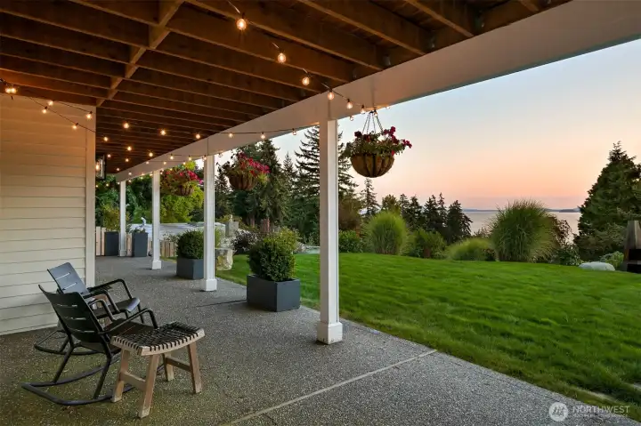 The covered patio itself is a showstopper, offering infinite bay and island views that set the stage for unforgettable evenings as the sun dips below the horizon. Whether you’re savoring a quiet moment or hosting loved ones, this outdoor haven is perfect for unwinding and soaking in nature’s beauty.