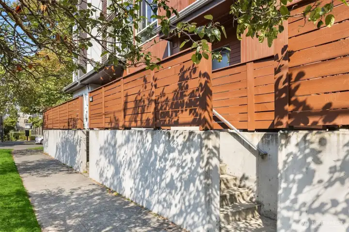 Private & Polished – A fenced entry offers simplicity with a modern edge.