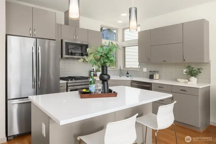 Perfectly planned for entertaining—gather around the oversized island for cocktails, conversation, or late-night snacks.