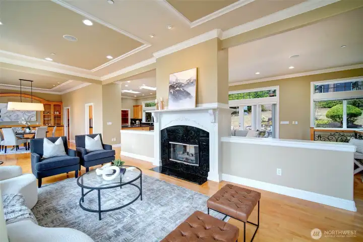 Greet guests in the formal living room, upon entry. Gather and chat near the grand marble fireplace or gaze out the large picture windows with a cup of coffee and a good book. Extensively remodeled and updates throughout home.