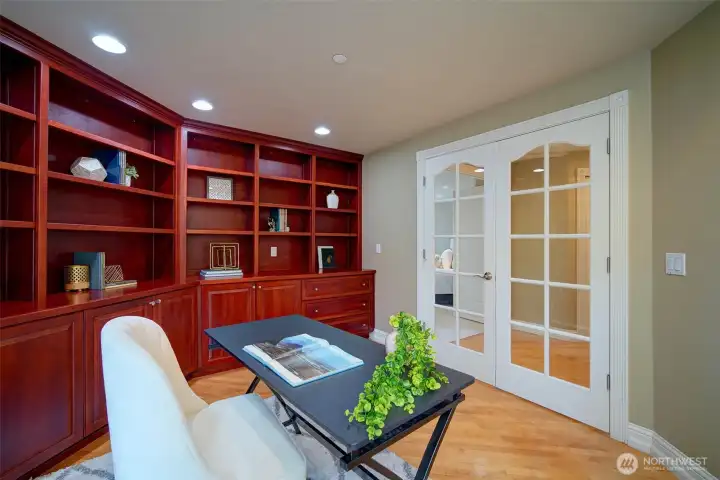 Office with beautiful built-in bookcases and French doors. Could be 6th bedroom.