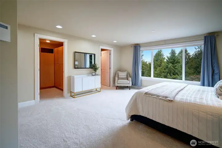 Lavish upstairs primary with treelined and territorial views. Dual walk-in closets and stunning ensuite bath. All new carpet in every bedroom.