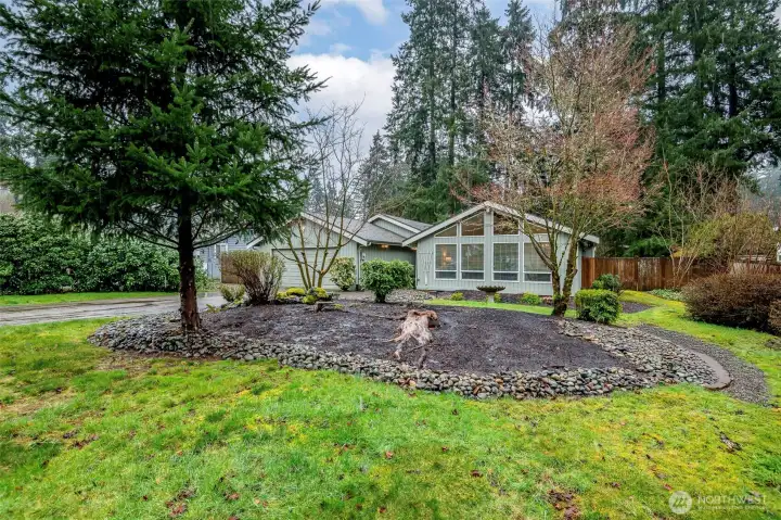 Tucked back off the quiet street with additional privacy via mature landscaping