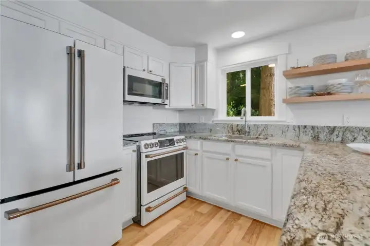 Kitchen with stainless GE Cafe Signature appliances