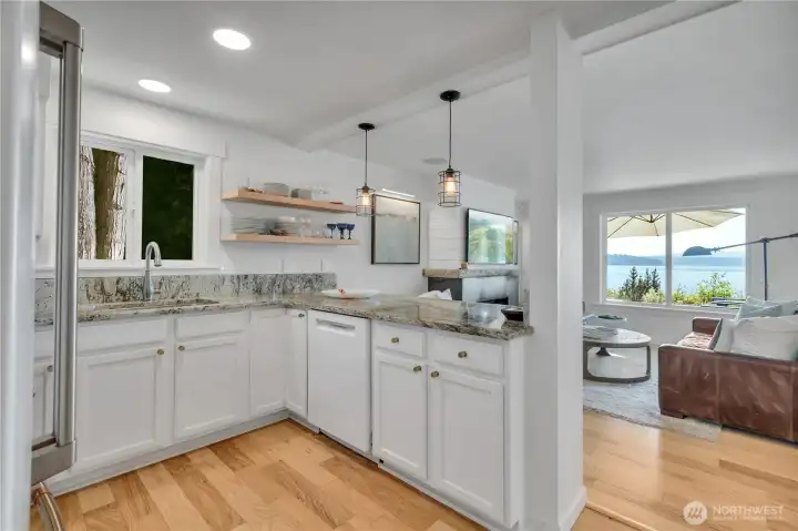 Kitchen is bright, has wonderful natural lighting and overlooks Great room to Sound Views