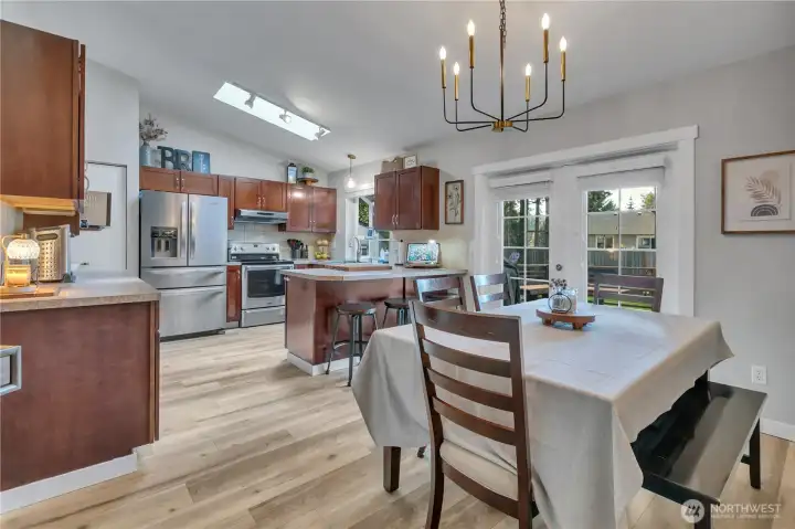 Dining room French doors open to the deck.