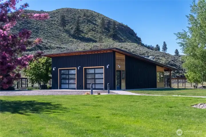 The two car garage has floor drains, lots of gear storage and electric car charging.