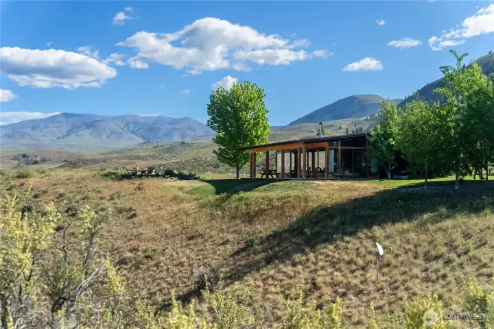 A wrap-around porch provides plenty of places to enjoy the remarkable views.