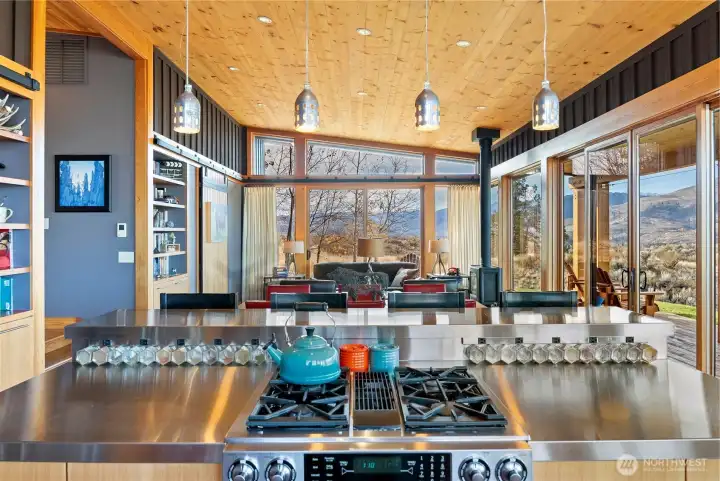 The kitchen is well-equipped with high-end appliances and built-in cupboards.
