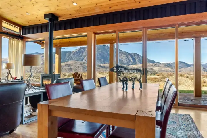 Large sliding glass doors lead from the dining area to the expansive covered porches.