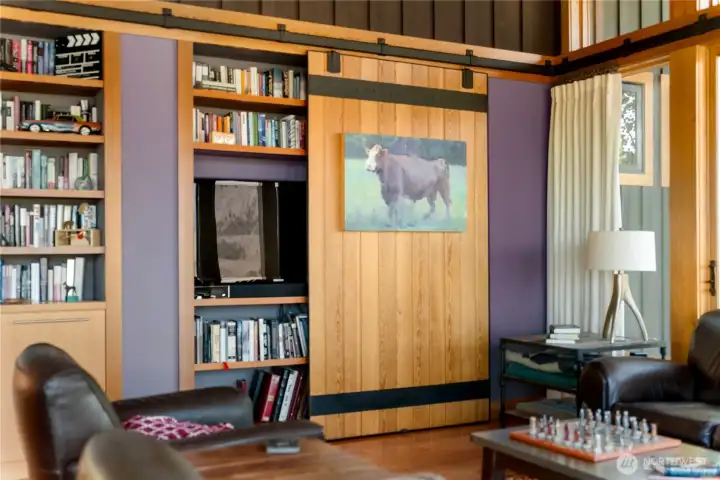 Sliding barn doors reveal the hidden entertainment system.