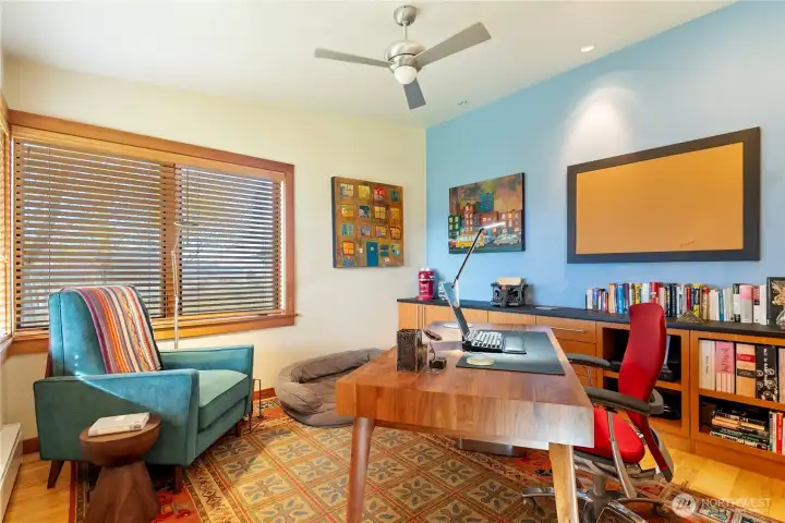 The small office has custom built-in cabinetry.