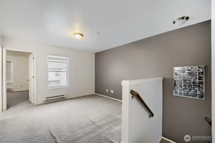 Versatile loft bonus room for work or retreat.