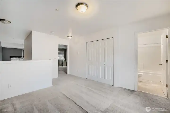 Closet for convenient storage and a full bath off the loft area.