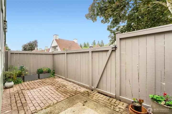 Private fenced yard with extensive patio.