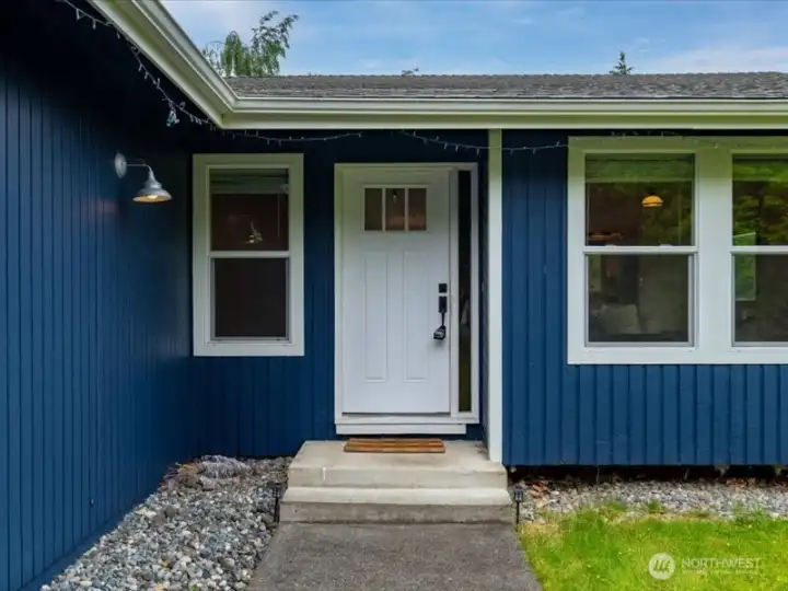 The entry is welcoming and there are just two steps to get inside. The entry is welcoming and there are just two steps to get inside.
