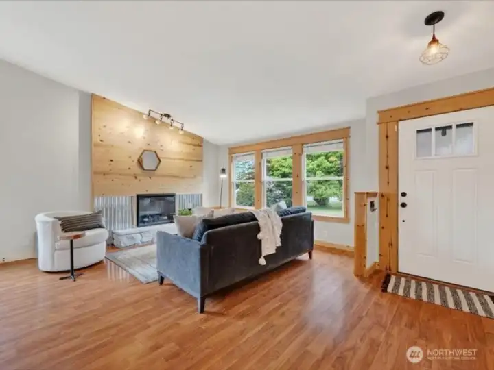The interior has been nicely updated with laminate floors and the electric fireplace has a wood and metal surround, making it the focal point of the living room. The interior has been nicely updated with laminate floors and the electric fireplace has a wood and metal surround, making it the focal point of the living room.