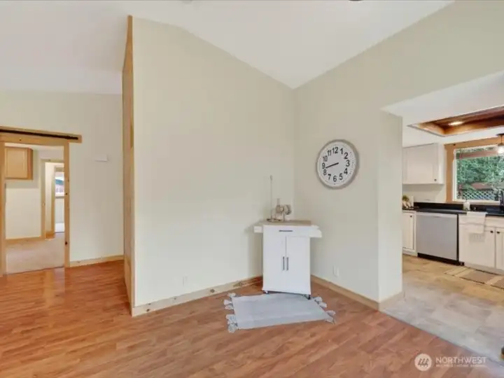 There is an alcove that is aching for a bar cart or a China cabinet just off the living room. There is an alcove that is aching for a bar cart or a China cabinet just off the living room.