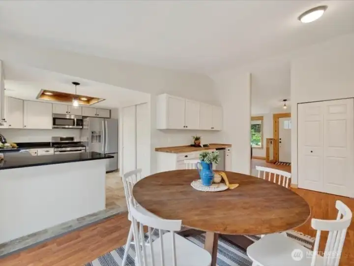 The dining room is very large and has a bar or buffet counter beyond. The dining room is very large and has a bar or buffet counter beyond.