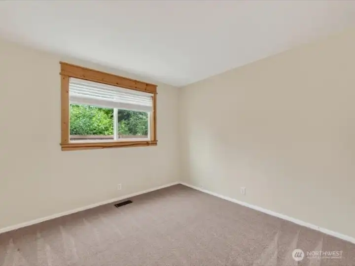The third bedroom looks to the side yard and is also well-sized. The third bedroom looks to the side yard and is also well-sized.