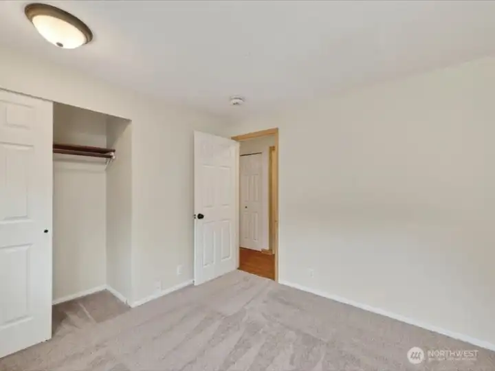 Looking across the 4th bedroom toward the hall and closet. Looking across the 4th bedroom toward the hall and closet.