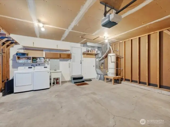 The garage houses the gas forced air furnace and the hot water heater. The garage houses the gas forced air furnace and the hot water heater.