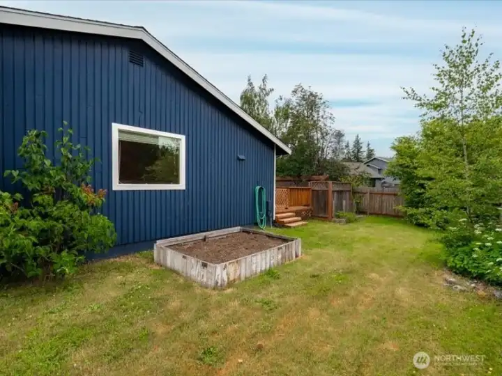 There is a raised garden bed on the south side yard...a great spot for tomoatoes! There is a raised garden bed on the south side yard...a great spot for tomoatoes!