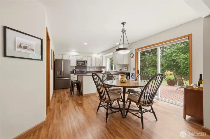 Eating nook that is open to great room and kitchen.  Slider to the back deck and yard.