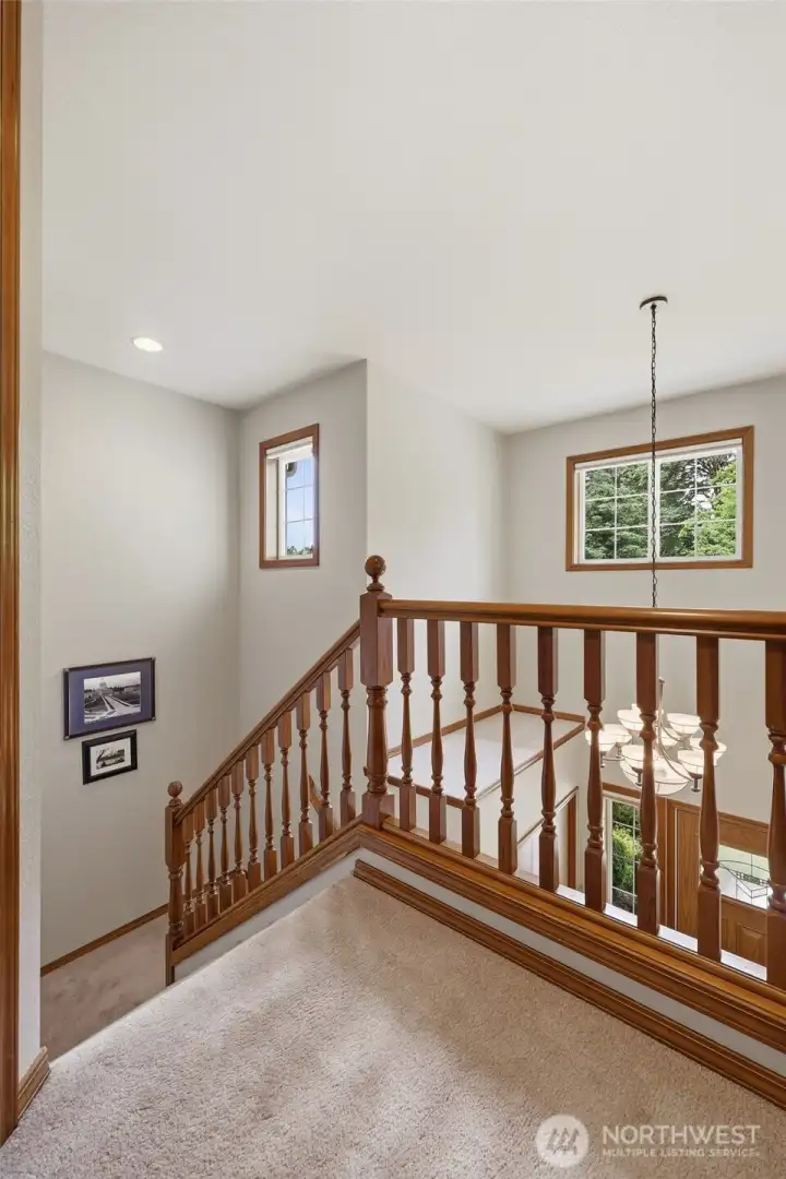 Nice and bright windows above entry and stairwell bring in great light.