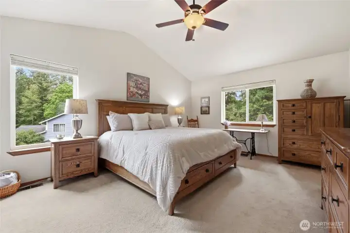 Primary bedroom suite with vaulted ceilings and 2 closets.