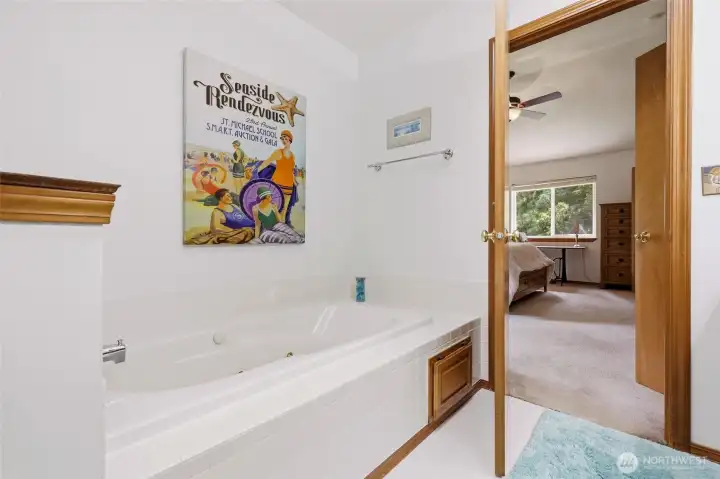 Relax in jetted tub in primary bathroom.