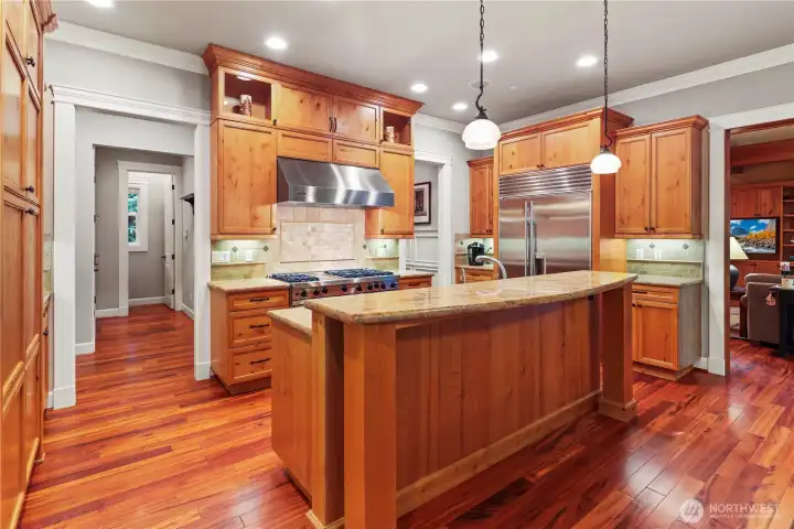 Gourmet kitchen with Viking and Subzero appliances, walk in pantry, and large appliance counter.