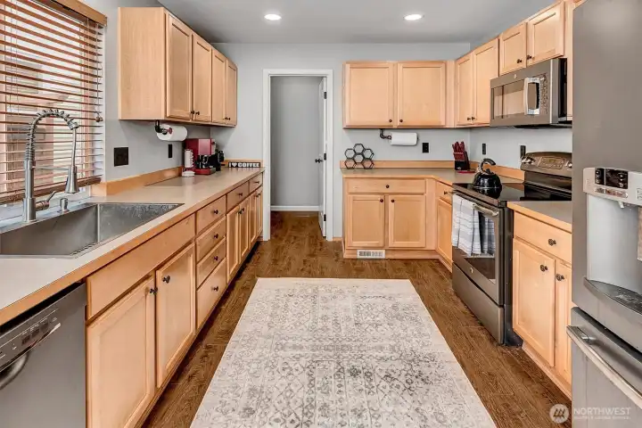 Very functional kitchen with gorgeous maple cabinets. Very functional kitchen with gorgeous maple cabinets.