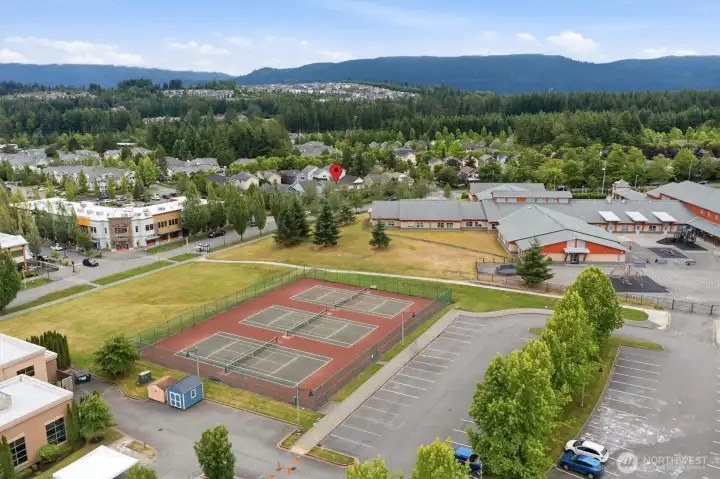 Enjoy pickleball and tennis courts right across the street. Enjoy pickleball and tennis courts right across the street.