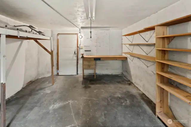 One-car garage with built-in work bench and storage.