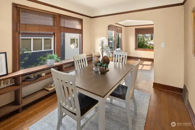 View from the kitchen doorway back through the light-filled dining room to the living room.