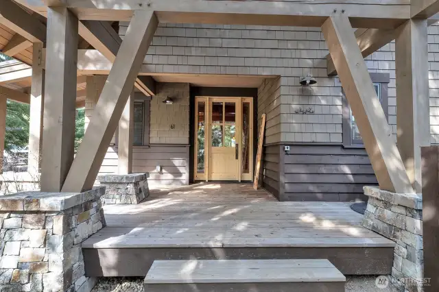 Inviting covered entry with private fenced cabana covered hot tub.