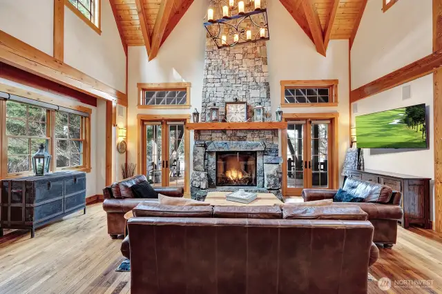 Stunning stone fireplace to cozy up to in the living room.