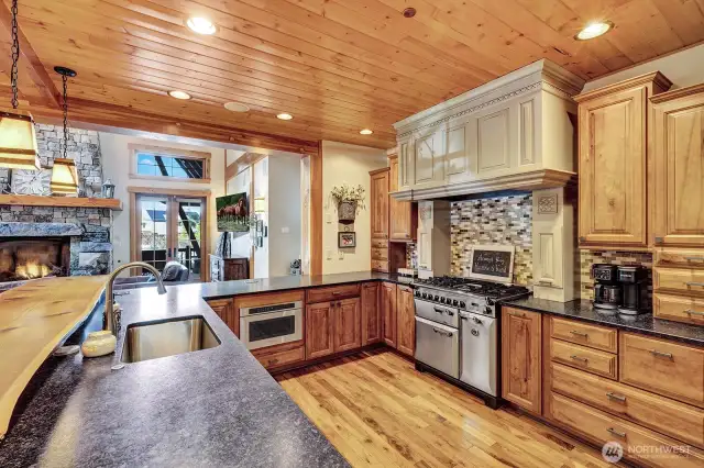 Spacious kitchen with high-end stainless appliances and walk in pantry.
