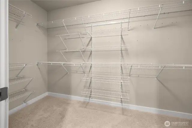 Extra large closet and shelving just feet off of the primary bathroom for convenience.