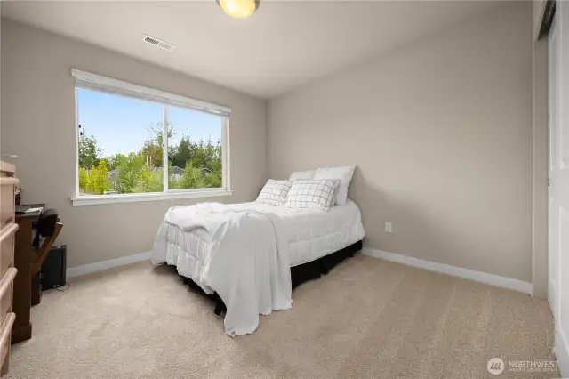 Guest bedroom #1 faces the front of the home