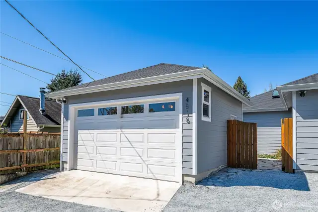 Garage with additional alley parking, or add that space to your yard.
