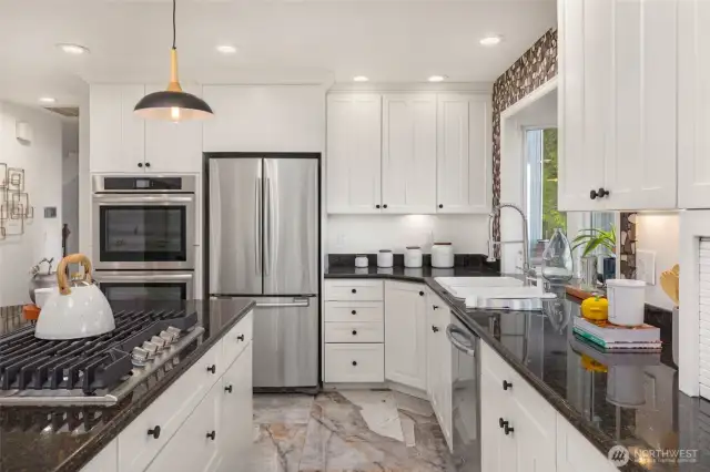The kitchen has lots of storage cupboard and pantry options.