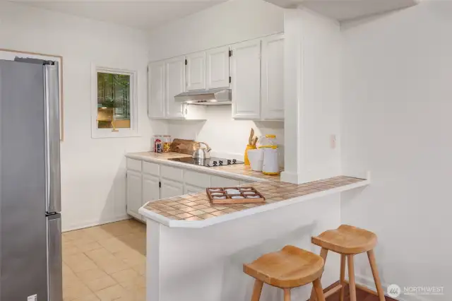 The second kitchen with eating space on lower level, perfect for nanny, guests or extended family.