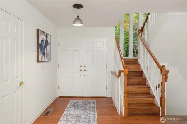 The foyer brings you into this lovely home, with rich hardwood floor.