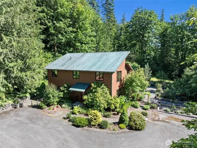 Welcome Home to over 9 acres of forest and gardens!